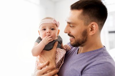 close up of father little baby girl at home