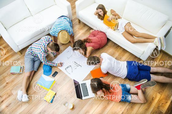Group of young students studying