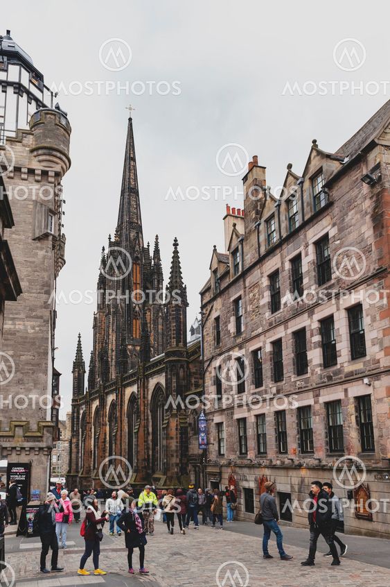 Edinburgh, Scotland - April 2018: Royal Mile, touristic street of Old Town Edinburgh City in Scotland, with Tron Kirk, former gothic church, now functioned as The Hub, a venue for various events and festivals