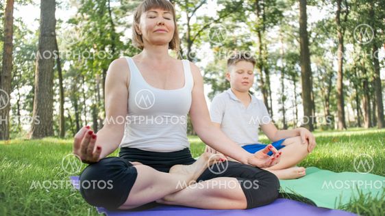 Photo of middle aged woman with 12 years old teenage boy...