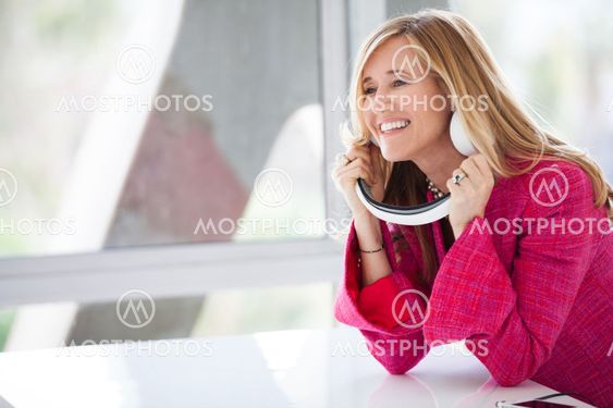 Beautiful Woman listening to music on a headphoe set