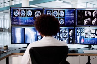 Caring African American Doctor Analyzing MRI Scan