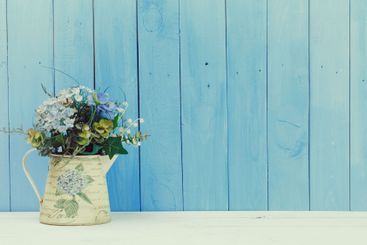 Wooden items of home decor close up on blue wooden...