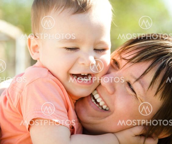 Portrait of a mother hugging her son