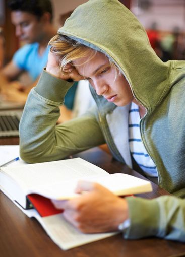 Struggling to get through the wor. A young student...