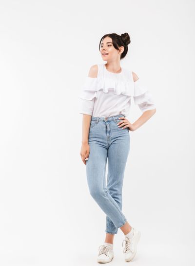 Full length portrait of elegant young woman with double...