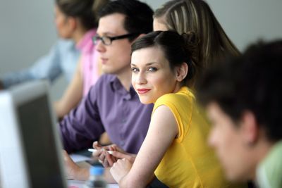 Trendy young people at computers