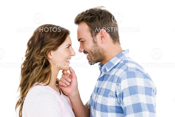 Happy young couple looking at each other and smiling