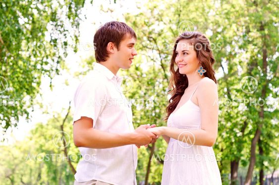 couple holding hands in the park