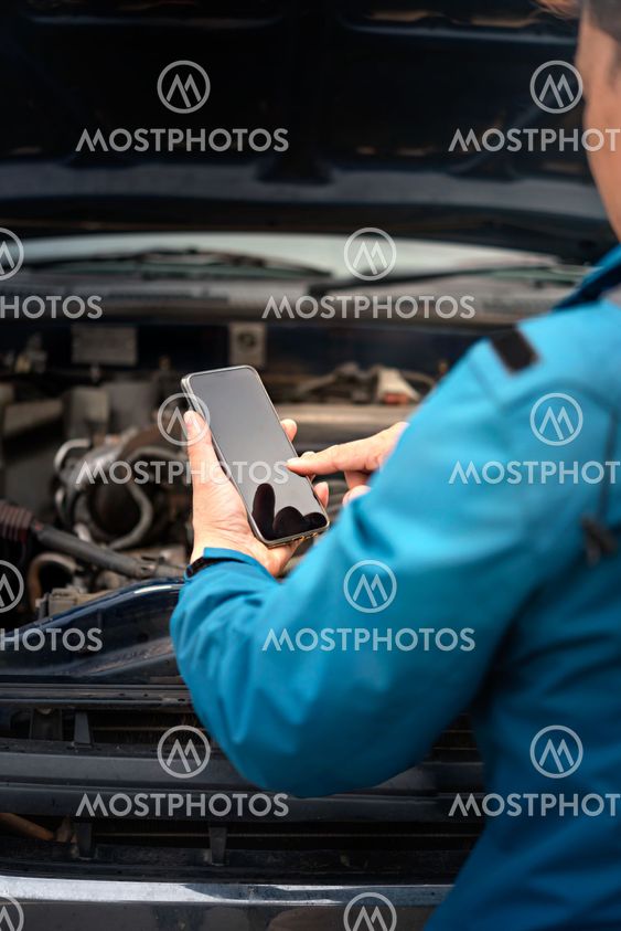 man having trouble with his broken car