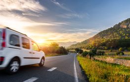 rental car in spain mountain landscape road at sunset