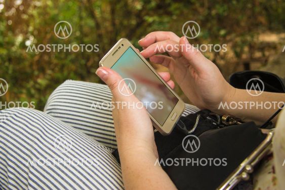 Woman's palm hold smartphone and touch a screen