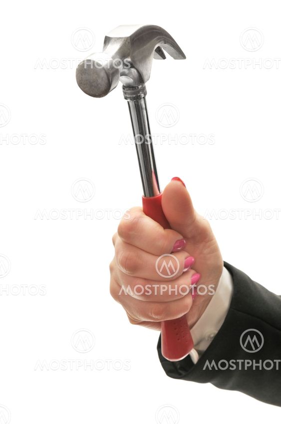 Hammer in hand of businesswoman