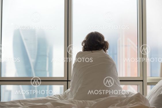 Young woman watching city view in the morning