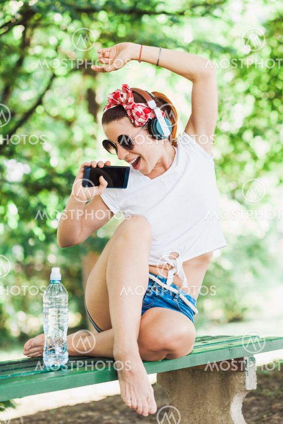 Young woman listening to the music