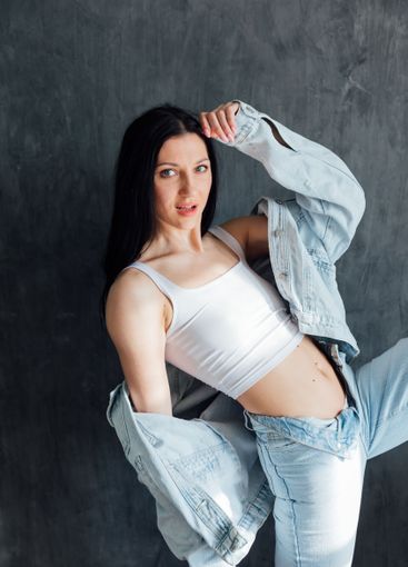 Beautiful slim fashion brunette woman in denim suit