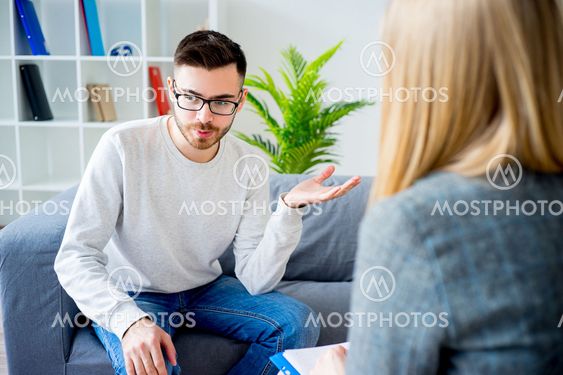 Young man on reception at psychologist