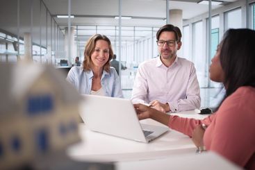 Professional couple discussing mortgage options