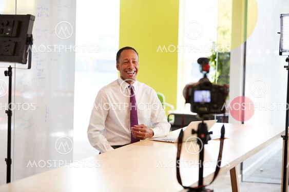 Middle aged businessman making a corporate video