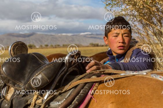 Kazakh Berkutchi (Eagle hunter) do saddles horse. In Bayan-Olgii Province is populated to 88,7% by Kazakhs.