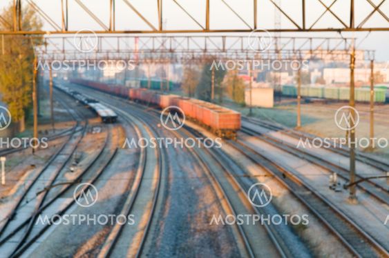Blurred image of cargo train station on sunrise