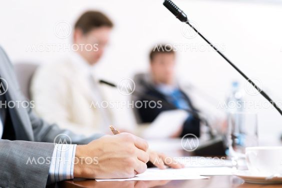Businessman writing on paper notes