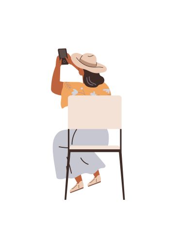 Woman in Hat Taking Photo with Smartphone While Sitting...