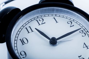 Close up of a black vintage alarm clock