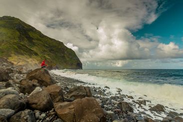 Woman on the beach in a cold day
