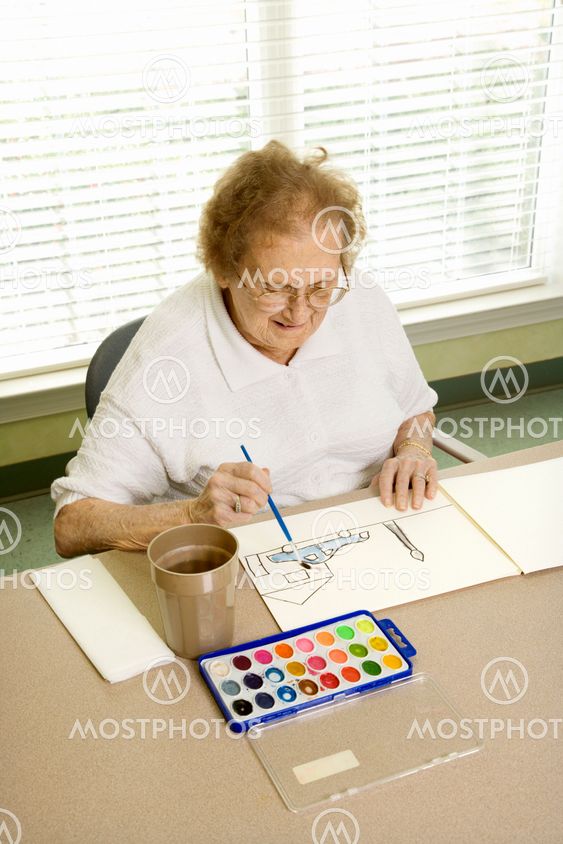 Mature woman painting.