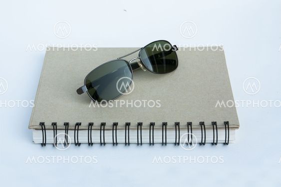 Sunglasses on a spiral notebook
