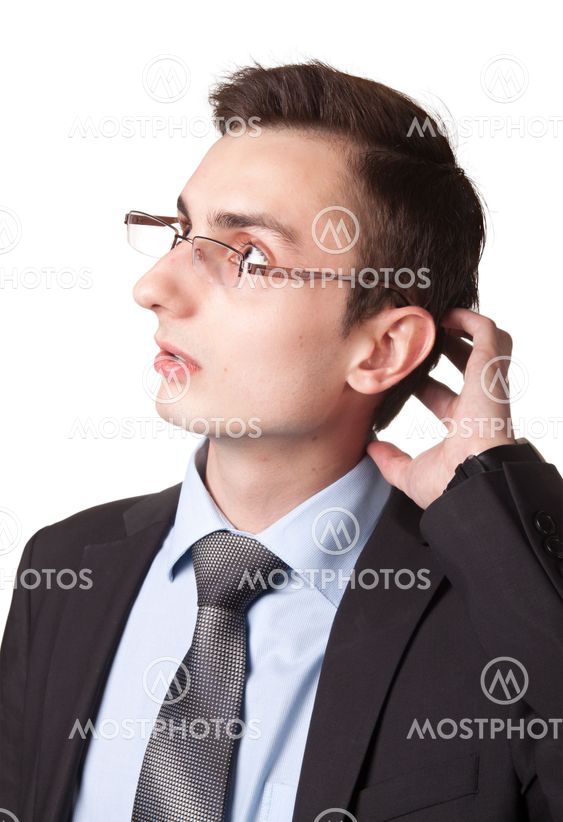 Young businessman in glasses thinking