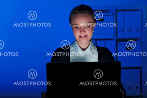 portrait of a woman in a night office