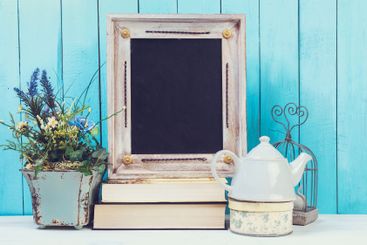 Shabby chic style home decorations on wooden background