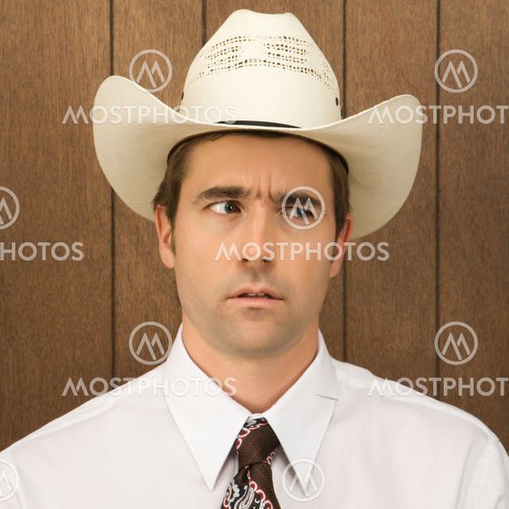 Man wearing cowboy hat.