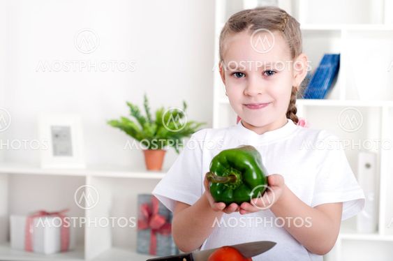 girl cooking vegetables