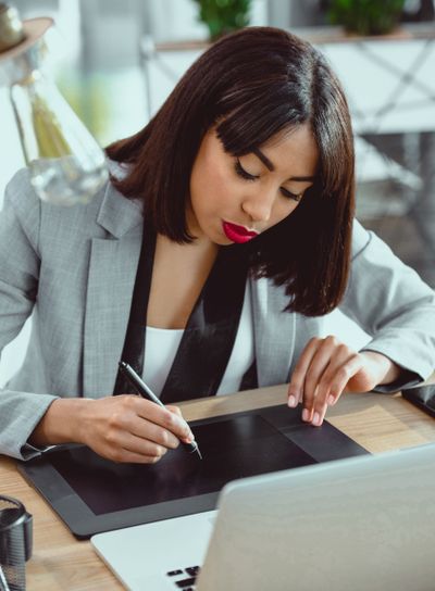 young african american designer working with drawing...