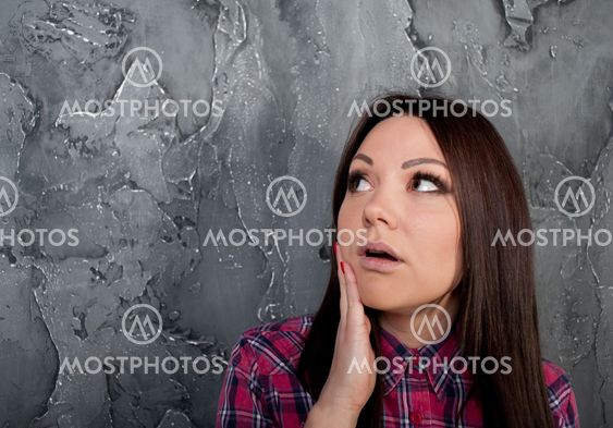The surprised young girl looks up