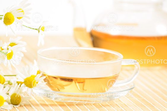 teacup with herbal chamomile tea