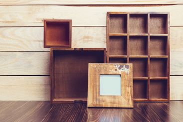 Cozy pastel wooden home decor objects on blue background