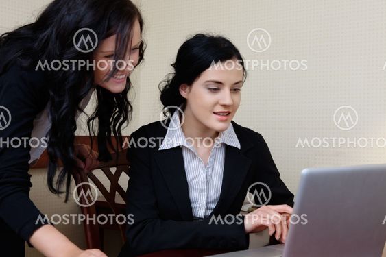 Female Executives Working on Laptop