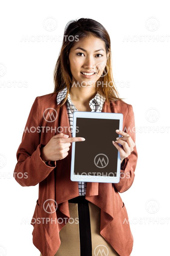 Smiling businesswoman pointing a tablet