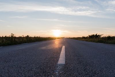 Extreme low angle view at an asphalt road