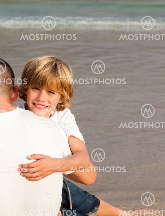 Portrait of a smiling Boy Hugging his father