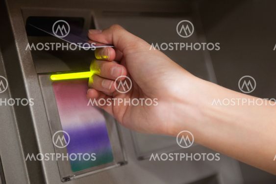 Close up of a hand inserting a credit card