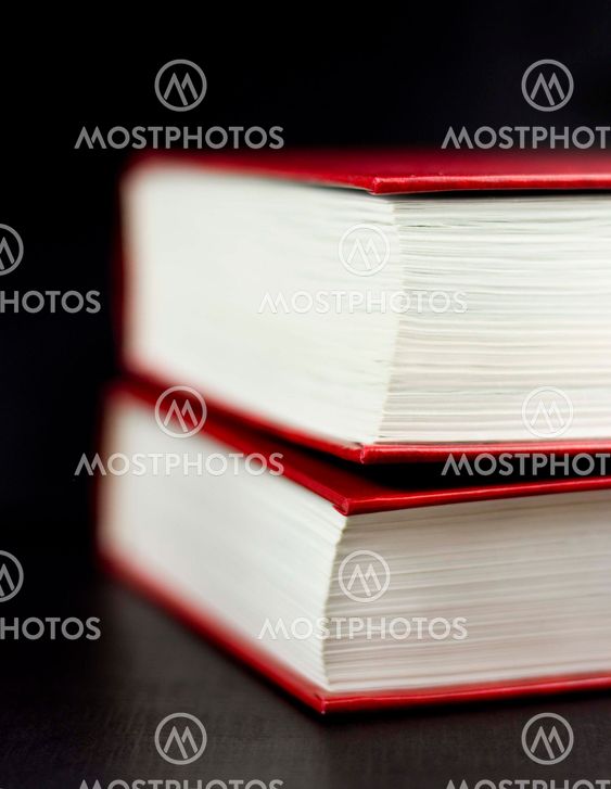 Two books on a black background