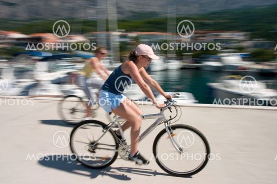 Two girls on bikes