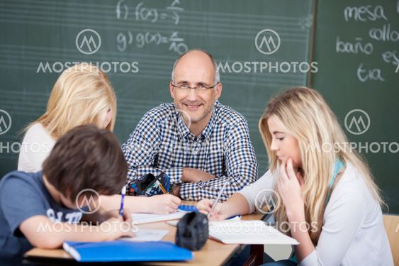 Motivated male teacher with his students