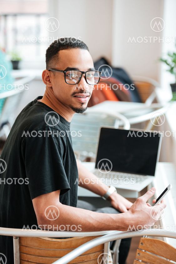 Portrait of a young afro american student in eyeglasses