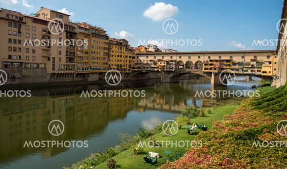 People resting at the riverside and Ponte Vecchio...